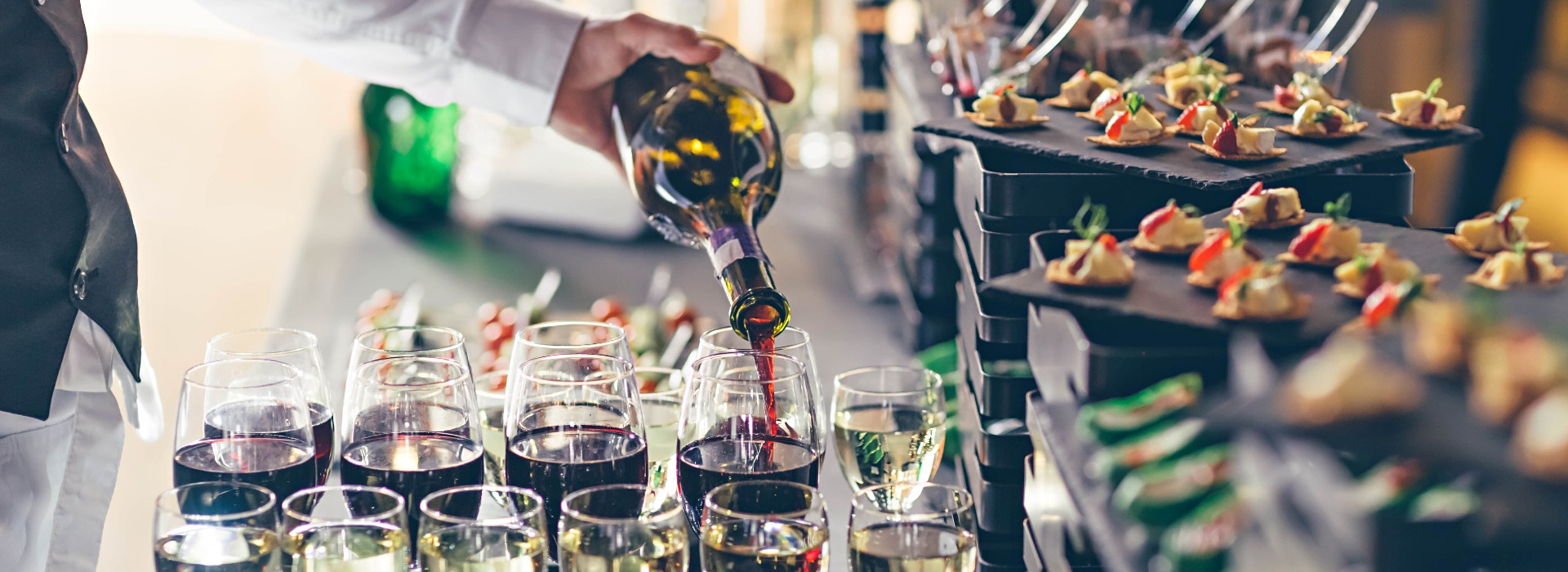 The waiter pours wine into glasses event catering concept jpg